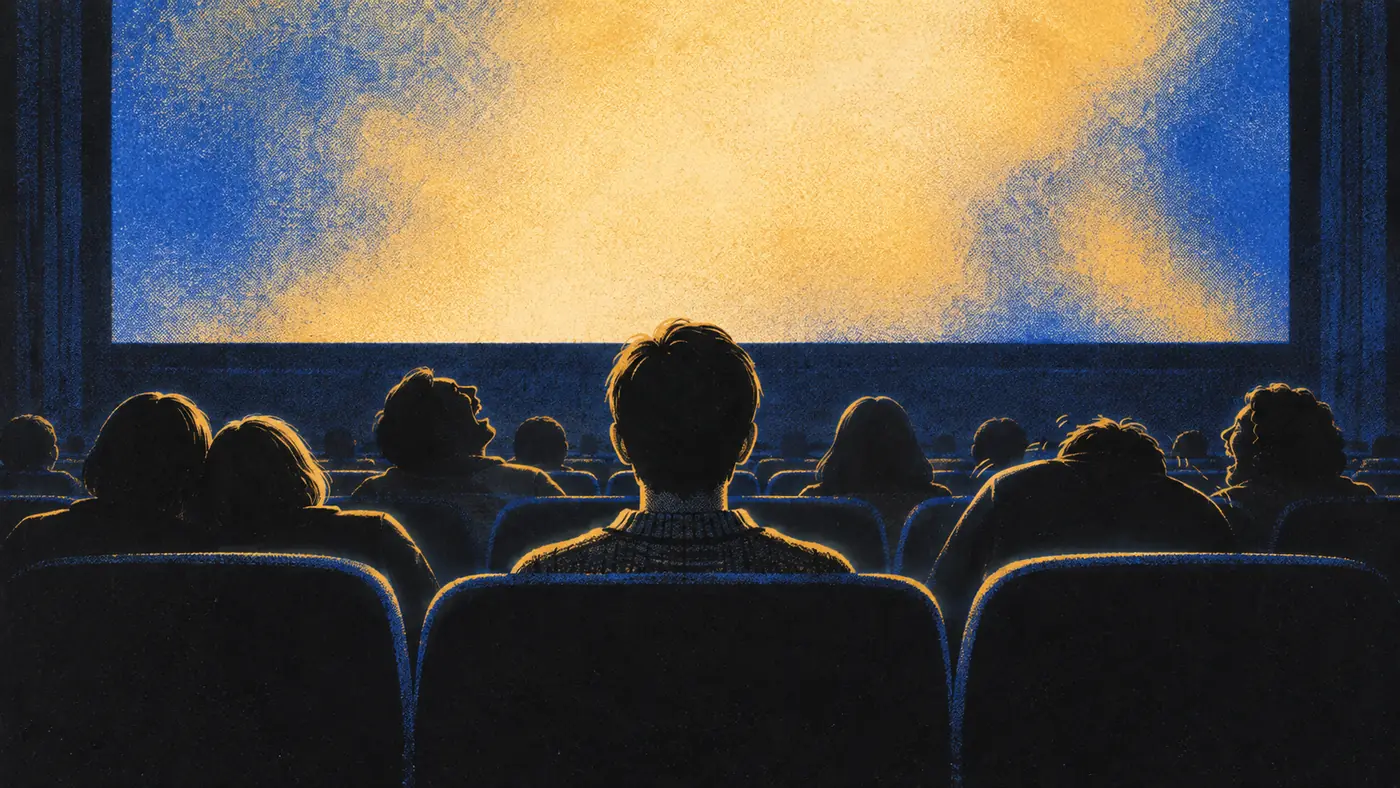Illustration of a cinema audience seen from behind, lit by a gold and blue screen. One viewer in the middle sits still and upright while the people around them laugh.